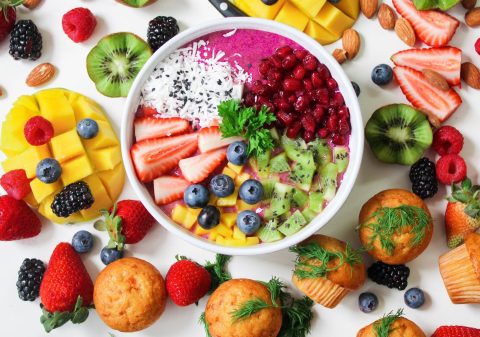 assorted sliced fruits in white ceramic bowl