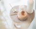 incense and white candles on a stool